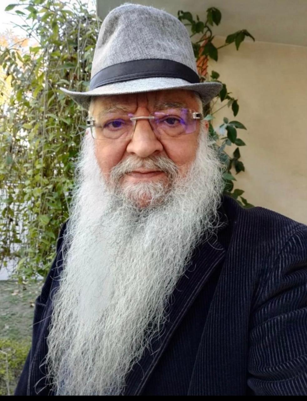 Prof. R. K. Sharma, co-author of Freedom in the Cage